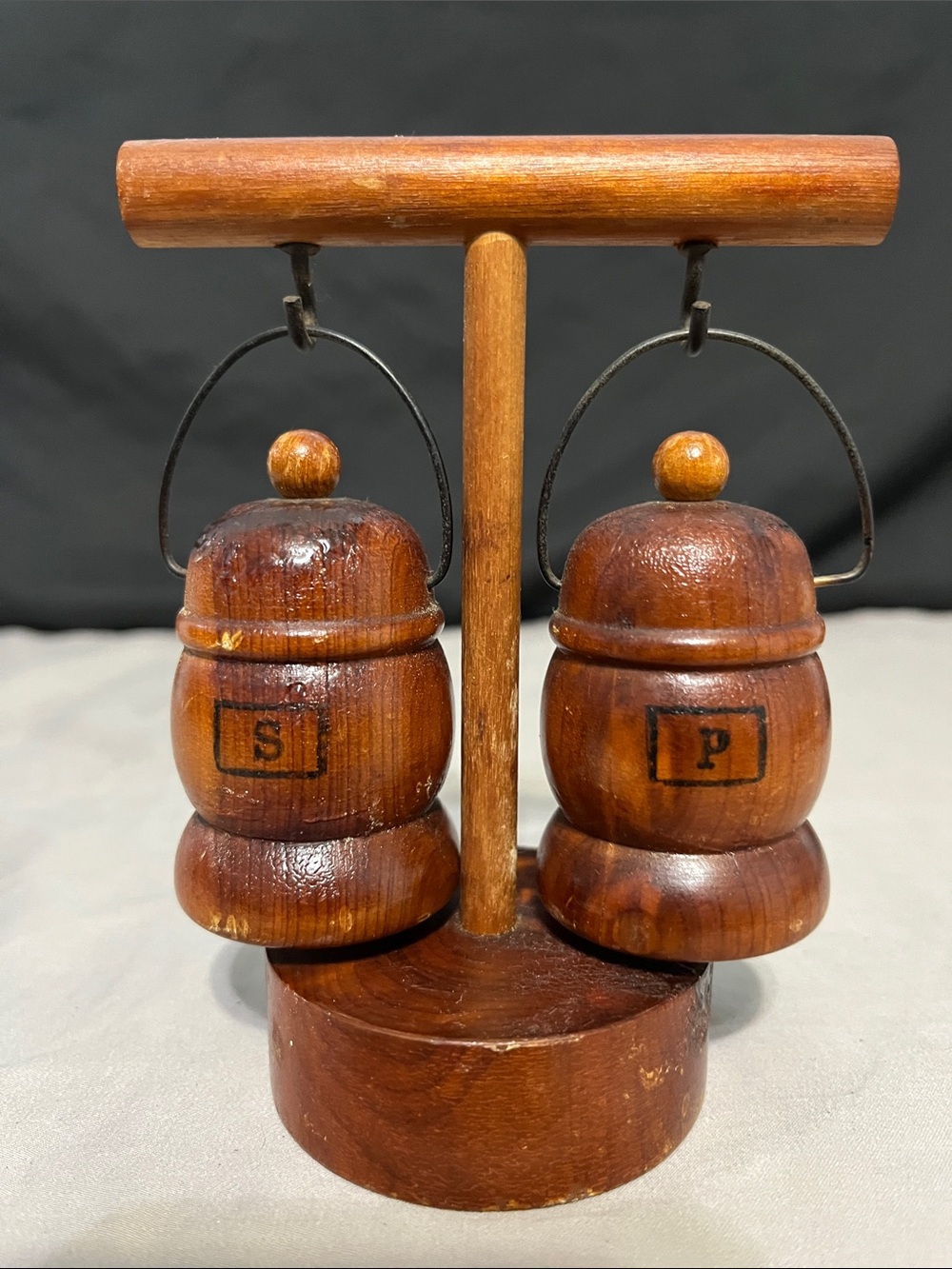 Vintage wooden salt and pepper shakers styled as hanging lantern souvenirs